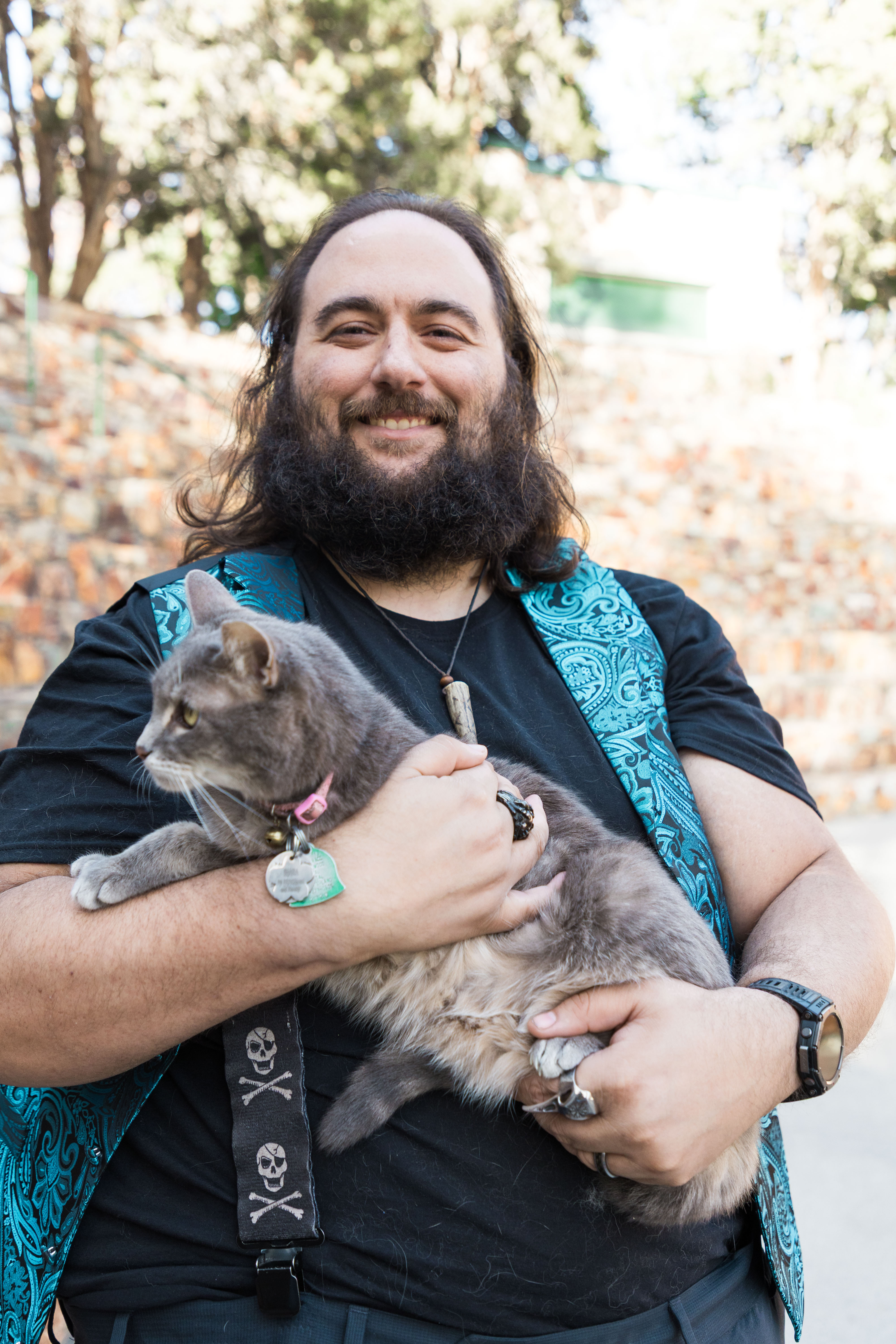 CJ holding a gray cat